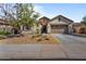 Beautiful single Gathering home with desert landscaping and a large driveway at 15665 W Coronado Rd, Goodyear, AZ 85395
