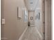 Hallway with light colored walls, baseboards, and flooring at 15665 W Coronado Rd, Goodyear, AZ 85395