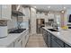 Contemporary kitchen with stainless appliances, an island and grey cabinetry at 15665 W Coronado Rd, Goodyear, AZ 85395