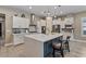 Stylish kitchen showcasing an island, pendant lighting, and modern stainless appliances at 15665 W Coronado Rd, Goodyear, AZ 85395