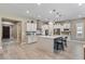 Spacious kitchen featuring an island, pendant lighting, and stainless steel appliances at 15665 W Coronado Rd, Goodyear, AZ 85395