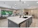 Bright kitchen with granite island, stainless steel appliances and an open concept layout at 15665 W Coronado Rd, Goodyear, AZ 85395