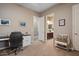 Home office with desk, chair and neutral decor at 15665 W Coronado Rd, Goodyear, AZ 85395