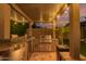 Entertain in style with this outdoor kitchen with granite countertops and stainless steel grill at 15665 W Coronado Rd, Goodyear, AZ 85395