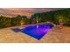 Stunning pool area for relaxation, with a swim-up table, lush gardens, and an inviting ambiance at 15665 W Coronado Rd, Goodyear, AZ 85395