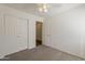 Simple bedroom featuring a closet and an open doorway to another room at 15962 W Gibson Ln, Goodyear, AZ 85338