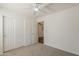 Bedroom featuring a closet and open doorway to another room at 15962 W Gibson Ln, Goodyear, AZ 85338