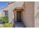 Inviting entryway featuring a covered porch and textured walls at 15962 W Gibson Ln, Goodyear, AZ 85338