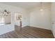 Spacious living room featuring archways and wood-look flooring at 15962 W Gibson Ln, Goodyear, AZ 85338