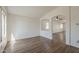 Bright living room featuring an open layout and wood-look flooring at 15962 W Gibson Ln, Goodyear, AZ 85338