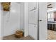 Hallway with carpeted floors and a built-in storage closet and a view of a bedroom with a bed at 1641 S Sossaman Rd, Mesa, AZ 85209