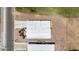 Aerial shot reveals a well-maintained roof, long driveway, and tidy landscaping surrounding the property at 1641 S Sossaman Rd, Mesa, AZ 85209