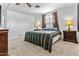 Comfortable bedroom featuring plush carpet, a ceiling fan, and coordinating decor for a relaxing retreat at 1641 S Sossaman Rd, Mesa, AZ 85209