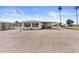 Charming white home featuring a covered patio, gravel yard, and a well-maintained exterior at 1641 S Sossaman Rd, Mesa, AZ 85209