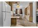 This carpeted dining area features a quaint round table and built-in wooden cabinetry for storage at 1641 S Sossaman Rd, Mesa, AZ 85209