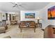 A cozy living room is decorated with desert art and earth tones at 1641 S Sossaman Rd, Mesa, AZ 85209