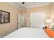 Cozy bedroom with closet and bed with white comforter and nightstand at 16466 W Lariat Ln, Surprise, AZ 85387