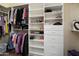 Spacious walk-in closet features custom shelves and ample storage for clothes and shoes at 16466 W Lariat Ln, Surprise, AZ 85387