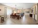 Spacious dining area with an elegant chandelier and a clear view into the living room at 16466 W Lariat Ln, Surprise, AZ 85387