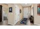 Welcoming entryway with light wood floors, neutral walls, and stylish decor at 16466 W Lariat Ln, Surprise, AZ 85387