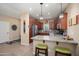 Charming kitchen with granite countertops, stainless steel appliances, and barstool seating at 16466 W Lariat Ln, Surprise, AZ 85387