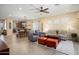 Bright, open-concept living area with views of the kitchen, dining, and comfortable seating at 16466 W Lariat Ln, Surprise, AZ 85387