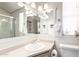 Bright bathroom featuring a neutral color palette and a large mirror at 17200 W Bell Rd # 1202, Surprise, AZ 85374
