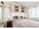 Comfortable bedroom with soft lighting, built-in storage, and a serene atmosphere at 17200 W Bell Rd # 1202, Surprise, AZ 85374