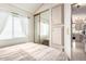 Tranquil bedroom features a mirrored closet and ample storage cabinets at 17200 W Bell Rd # 1202, Surprise, AZ 85374