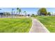 Community sports courts bordered by a sidewalk, and landscaping at 17200 W Bell Rd # 1202, Surprise, AZ 85374