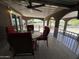Relax on this covered patio with comfortable red seating and a dining table at 17200 W Bell Rd # 1202, Surprise, AZ 85374