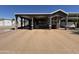Inviting home featuring a covered carport and charming front porch area at 17200 W Bell Rd # 1202, Surprise, AZ 85374