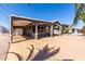 Inviting home exterior featuring a covered patio, wide driveway, and manicured landscaping at 17200 W Bell Rd # 1202, Surprise, AZ 85374