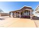 Attractive home with covered patio, spacious driveway, and large bay window at 17200 W Bell Rd # 1202, Surprise, AZ 85374