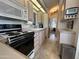 Efficient kitchen with a white double basin sink and classic appliances at 17200 W Bell Rd # 1202, Surprise, AZ 85374