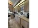 Well-lit kitchen with classic countertops, cabinetry and a garden window at 17200 W Bell Rd # 1202, Surprise, AZ 85374