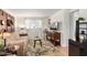 Inviting living room with a comfortable tan sofa, modern TV, and a stylish leaf-patterned rug at 17200 W Bell Rd # 1202, Surprise, AZ 85374