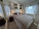 Comfortable main bedroom with built-in storage and soft, neutral tones at 17200 W Bell Rd # 1202, Surprise, AZ 85374