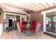 Inviting outdoor space features a table, chairs, and ceiling fan at 17200 W Bell Rd # 1202, Surprise, AZ 85374