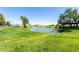 Scenic pond with a fountain and lush landscaping at 17200 W Bell Rd # 1202, Surprise, AZ 85374