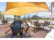 Covered outdoor seating area next to the tennis courts at 17200 W Bell Rd # 1202, Surprise, AZ 85374