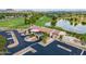 Aerial view of Bellair Golf Club featuring greens, ponds, clubhouse, and well-maintained landscaping at 17838 N 45Th Ave, Glendale, AZ 85308