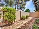 Fenced-in backyard featuring a small stone pathway, low maintenance landscaping and a wood fence at 17838 N 45Th Ave, Glendale, AZ 85308