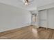 A bright bedroom offers ample space, a ceiling fan, a large window, and a closet at 17838 N 45Th Ave, Glendale, AZ 85308