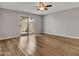 Spacious bedroom with hardwood floor and sliding glass door to private patio at 17838 N 45Th Ave, Glendale, AZ 85308
