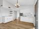 Bright dining space with modern shelving adjacent to updated kitchen at 17838 N 45Th Ave, Glendale, AZ 85308