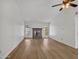 Bright living room featuring light wood floors and a classic brick fireplace at 17838 N 45Th Ave, Glendale, AZ 85308
