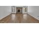 Spacious living room with updated floors, brick fireplace and natural light at 17838 N 45Th Ave, Glendale, AZ 85308