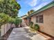 The spacious patio offers greenery, a block wall, privacy fence, and a sliding glass door to enjoy the outdoors at 17838 N 45Th Ave, Glendale, AZ 85308