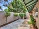 A spacious patio features nice landscaping with trees, bushes, and a privacy fence to enjoy the outdoors at 17838 N 45Th Ave, Glendale, AZ 85308